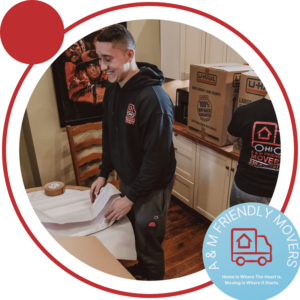 Image of A & M Friendly Movers crew with logo