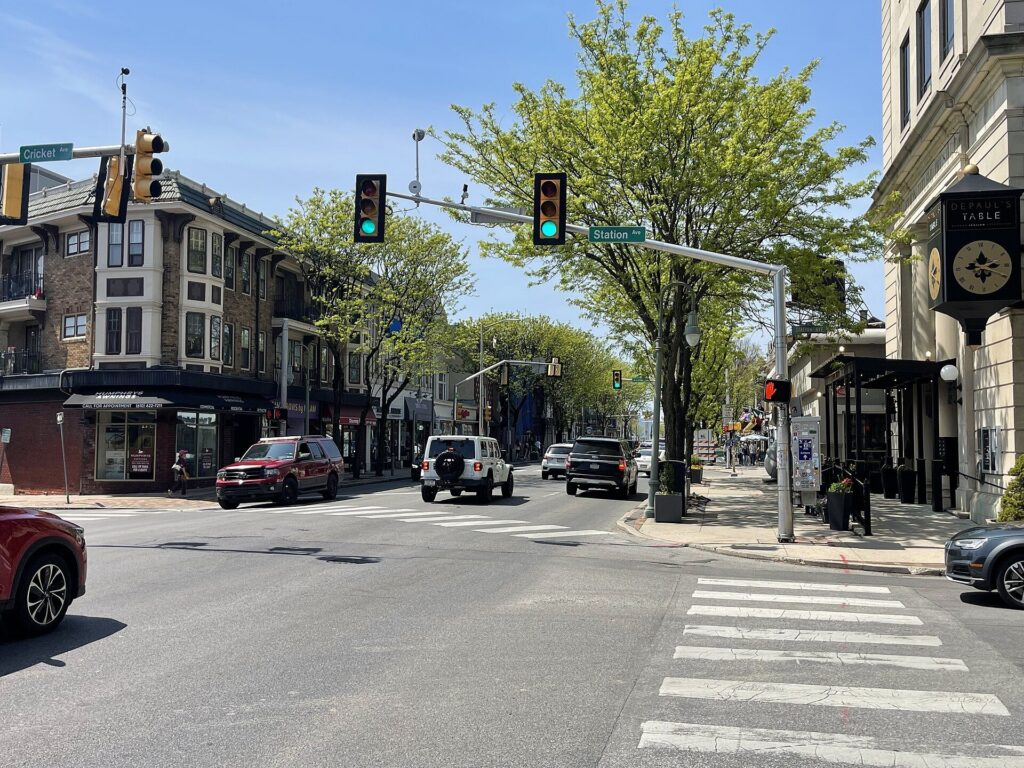 Shops and tree-lined sidewalks along Lancaster Avenue in downtown Ardmore, PA