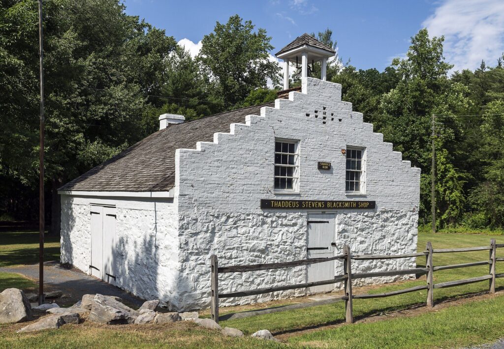 The whitewashed stone Thaddeus Stevens Blacksmith Shop at Caledonia State Park near Fayetteville, Pennsylvania