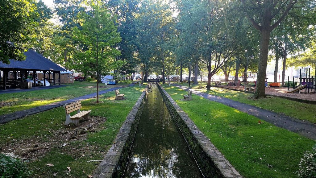 The stone-lined spring run and shady paths of Lititz Springs Park in Lititz, Pennsylvania