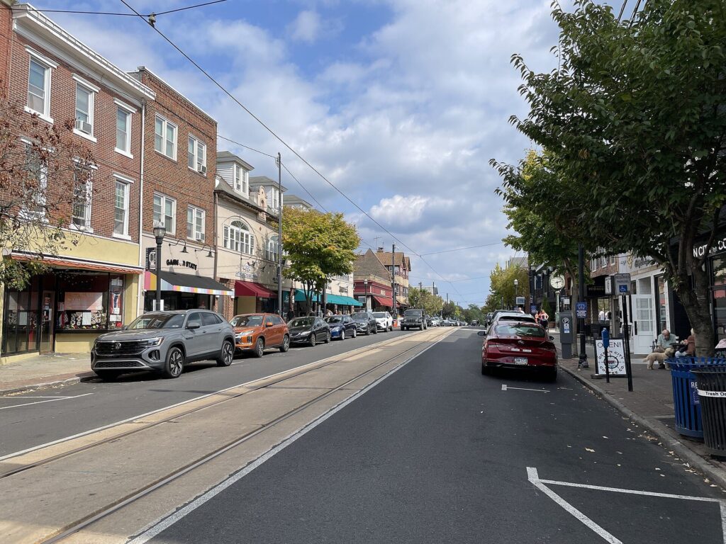 State Street in downtown Media, PA, with shops and the trolley tracks down the middle of the road