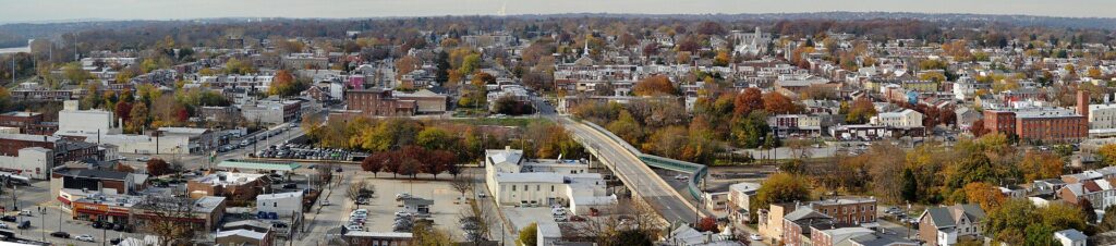 Panoramic view over Norristown, Pennsylvania, with rooftops, church steeples and fall trees