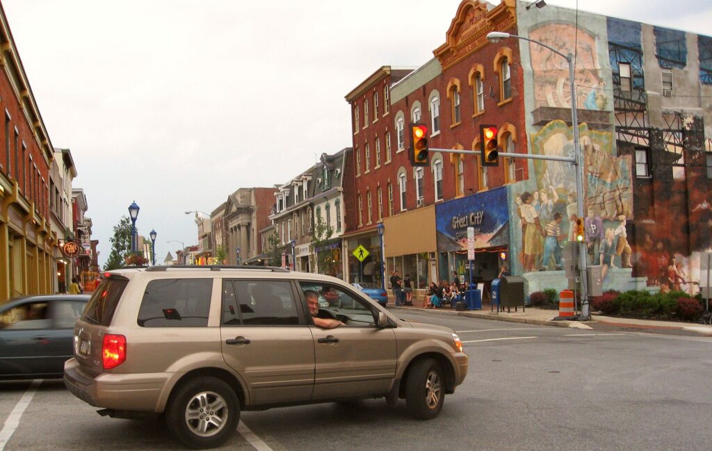 Downtown Phoenixville, PA at Bridge and Main Streets on a summer evening